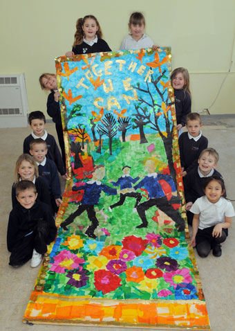 Pupils from Little Mead Primary with their collage (Martin Chainey).