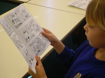 Avon Primary pupil reading the class comic book (Dympna Leonard).