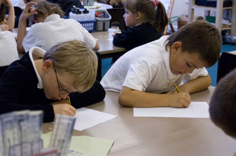 Pupils busy writing their poems about Clifton Suspension Bridge at Fair Furlong Primary (Vicky Washington).