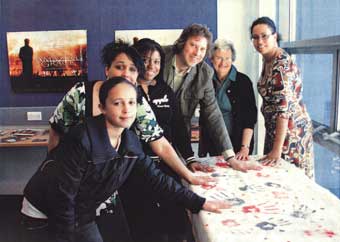 Making handprints at the abolition event held at Rossmore Library and Learning Centre. Copies of Small Island were given to participants.