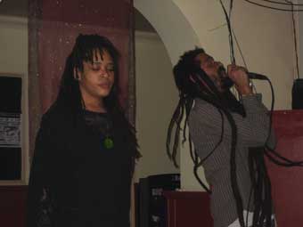 Michelle Scally Clarke from Leeds alongside reggae DJs - Senator Sound System - at the Heart Beats poetry night in Liverpool that was linked to Small Island Read 2007.
