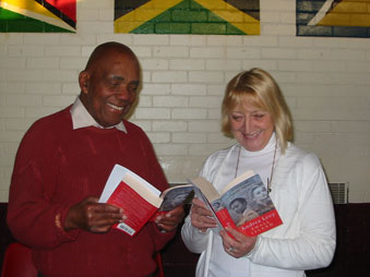 Mr Priddie and Violet from the Caribbean Reading Group in Liverpool with copies of Small Island (Liverpool Reads).